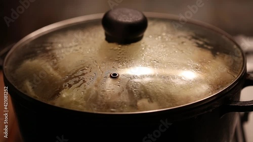 evaporation on the pan lid, glass with evaporation. Cooking steam on the lid close-up. Cooking