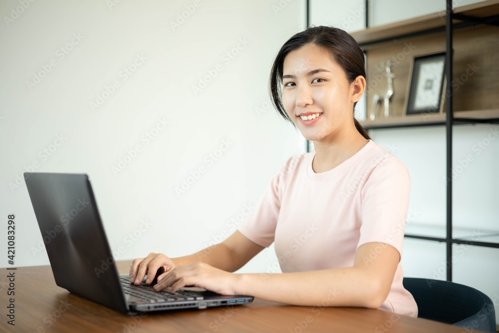 Asian business woman with notebook in the office Asian business woman with notebook in the office