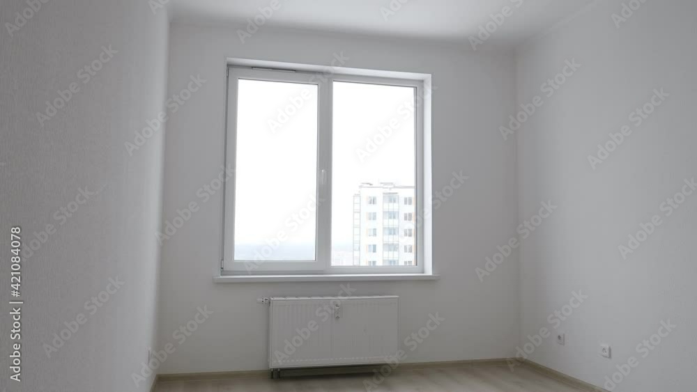 Empty light room with white wall interior and window Empty light room with white wall interior and window