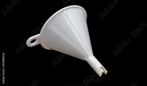 white funnel on black background close up
