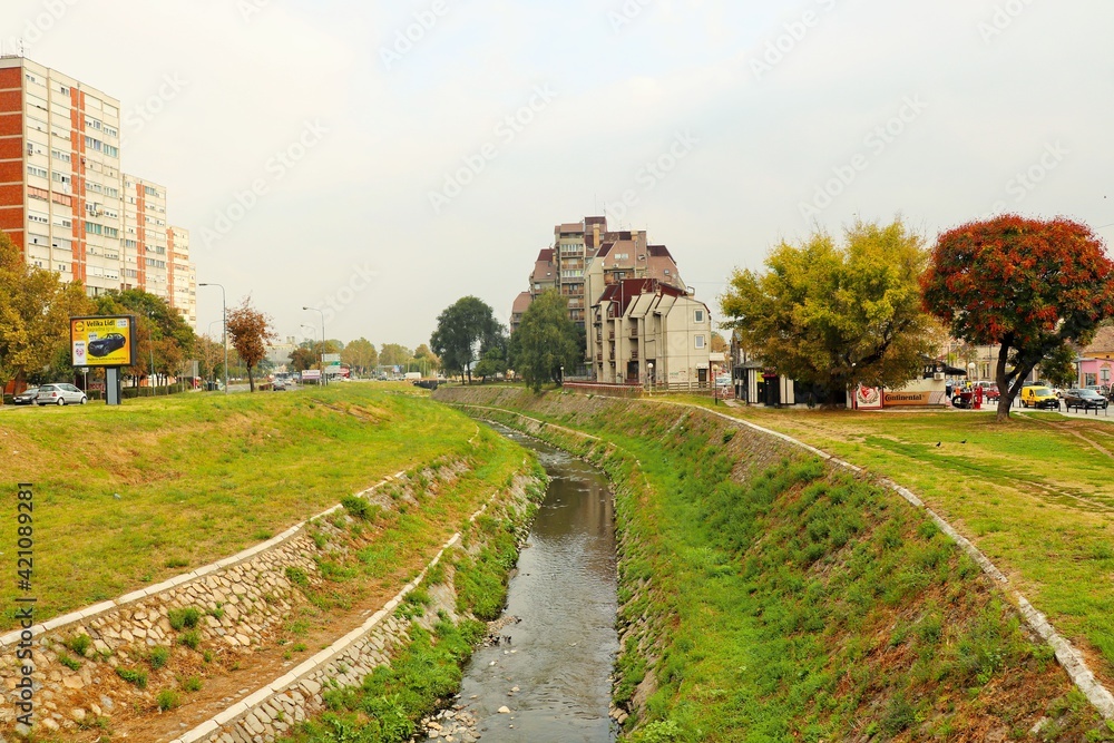 Water channel with fortified banks of masonry 