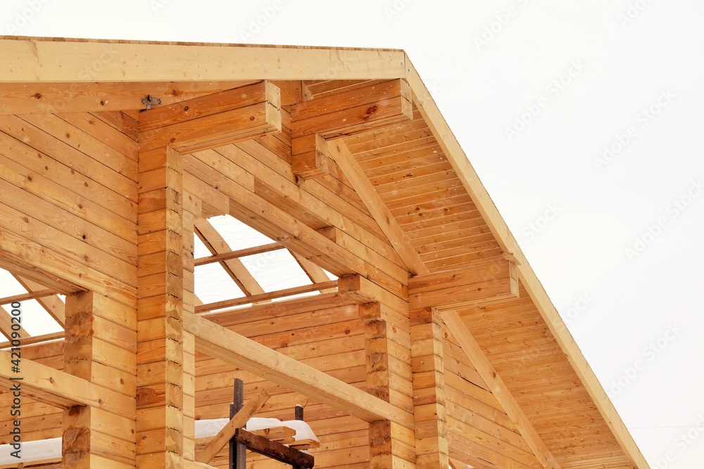 Facade of a pine log house under construction Facade of a pine log house under construction
