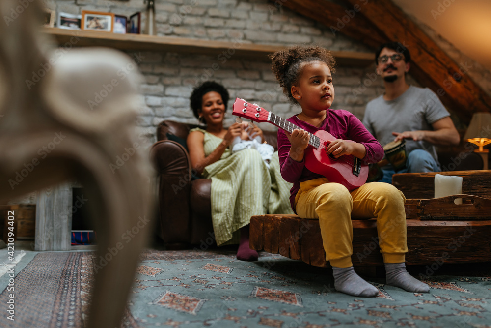 Multiracial family of three having fun at home