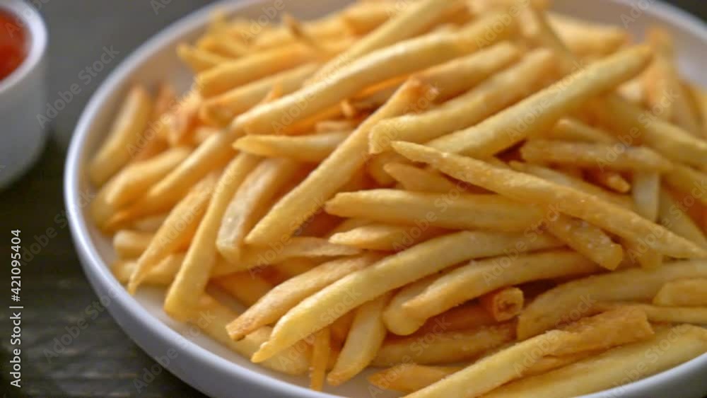French fries or potato chips with sour cream and ketchup French fries or potato chips with sour cream and ketchup