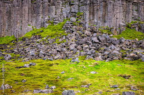 Gerduberg Basalt Columns closeup abstract view of landscape in Snaefellsnes Iceland with green grass on summer day photo