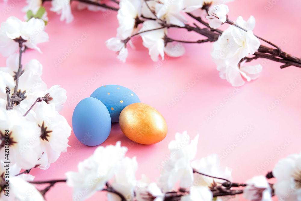 Blue and gold easter eggs on pink background Blue and gold easter eggs on pink background