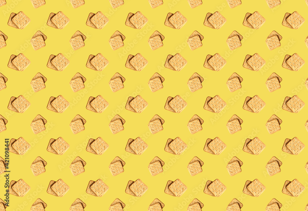 Pattern with square crackers on a yellow background. Product template. Pattern with square crackers on a yellow background. Product template.