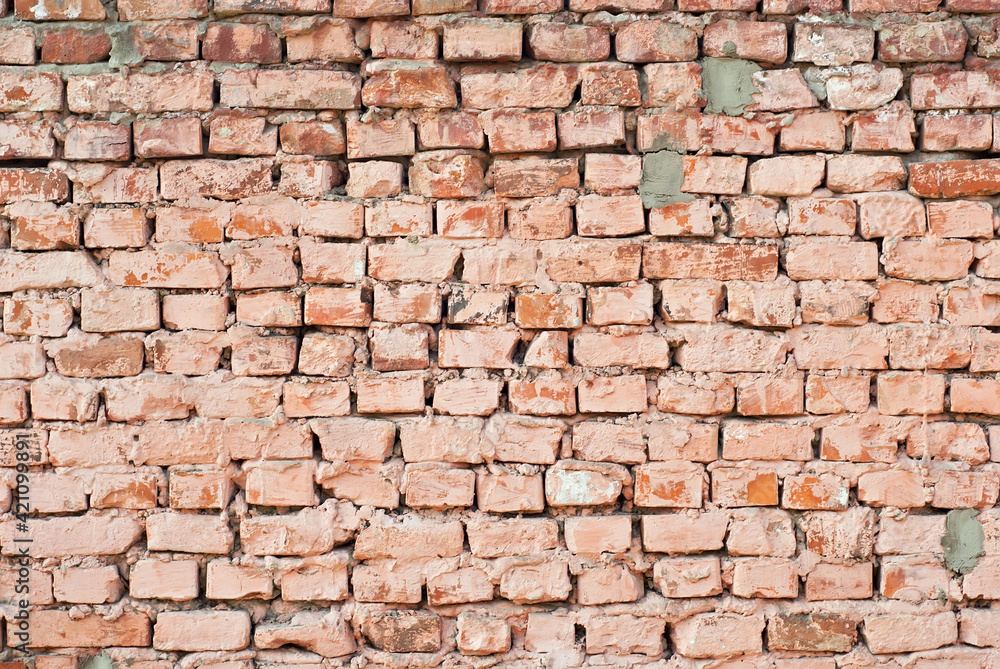 Texture of brick wall. Samples of wall or fence are presented at exhibitions. Orange brick close up. Texture of brick wall. Samples of wall or fence are presented at exhibitions. Orange brick close up.