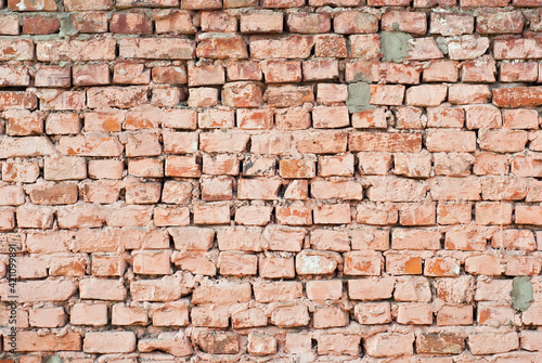 Texture of brick wall. Samples of wall or fence are presented at exhibitions. Orange brick close up.