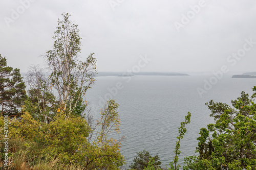 A wonderful view from mountains to nature with a view of Baltic Sea on a cloudy summer day. Sweden. © Alex