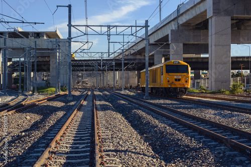 The rail diesel trains are running parallel to the tracks. In Thailand