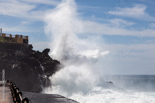 Massive wave hitting the rocky shore in Tenerife