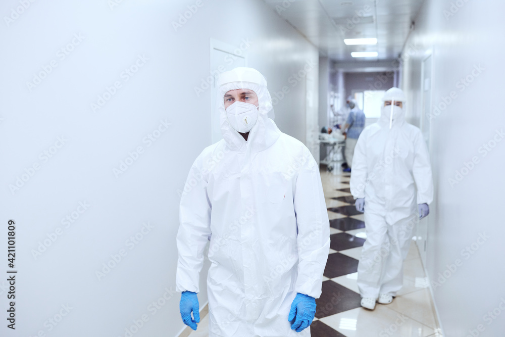 Fototapeta premium Doctors in protective uniforms working at hospital during coronavirus pandemic