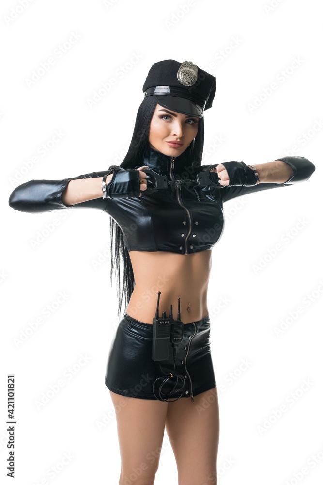 Sexy woman in leather police uniform in studio Sexy woman in leather police uniform in studio