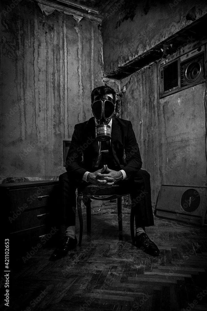 Men in suit and gas mask