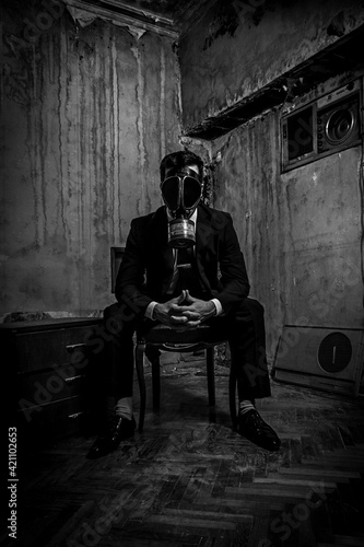 Men in suit and gas mask