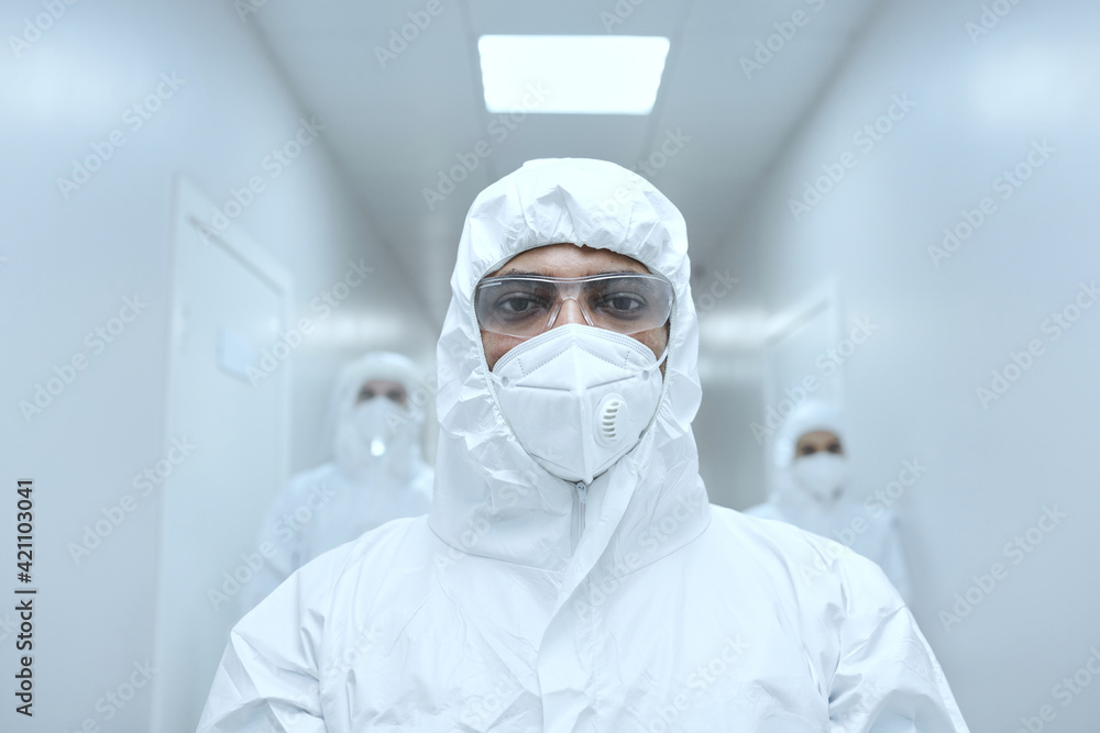 Portrait of doctor in protective wear glasses and mask looking at camera while working during pandemic at hospital Portrait of doctor in protective wear glasses and mask looking at camera while working during pandemic at hospital
