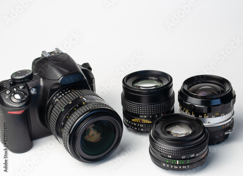 Camera and set of photo lens on white background