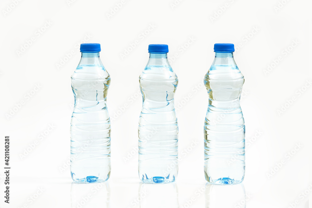 Bottled water isolated over a white background - three plastic bottles of water Bottled water isolated over a white background - three plastic bottles of water