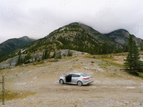 Atmospheric photo of a car in the foggy mountains © Maryna