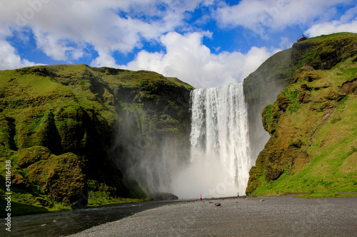 Skókafoss waterfall under cloudy sky, Iceland