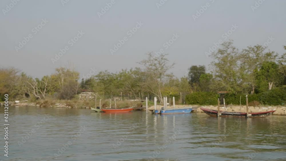 Boats moored on Venetian Lagoon in Torcello, Italy Boats moored on Venetian Lagoon in Torcello, Italy