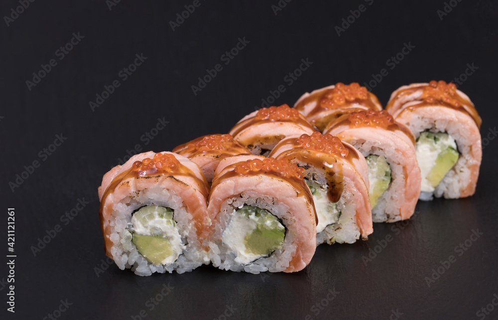 Sushi rolls Roll on black background. Sushi menu. Japanese food Sushi rolls Roll on black background. Sushi menu. Japanese food
