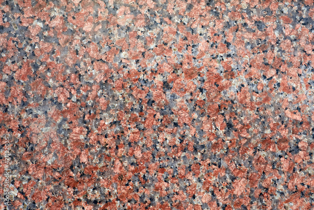 The texture of natural polished granite. Pattern, background. The texture of natural polished granite. Pattern, background.