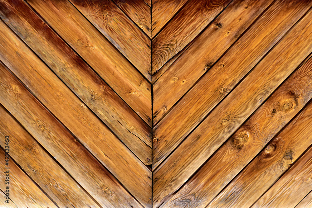 Symmetrical pattern of wooden planks. Texture, background. Symmetrical pattern of wooden planks. Texture, background.