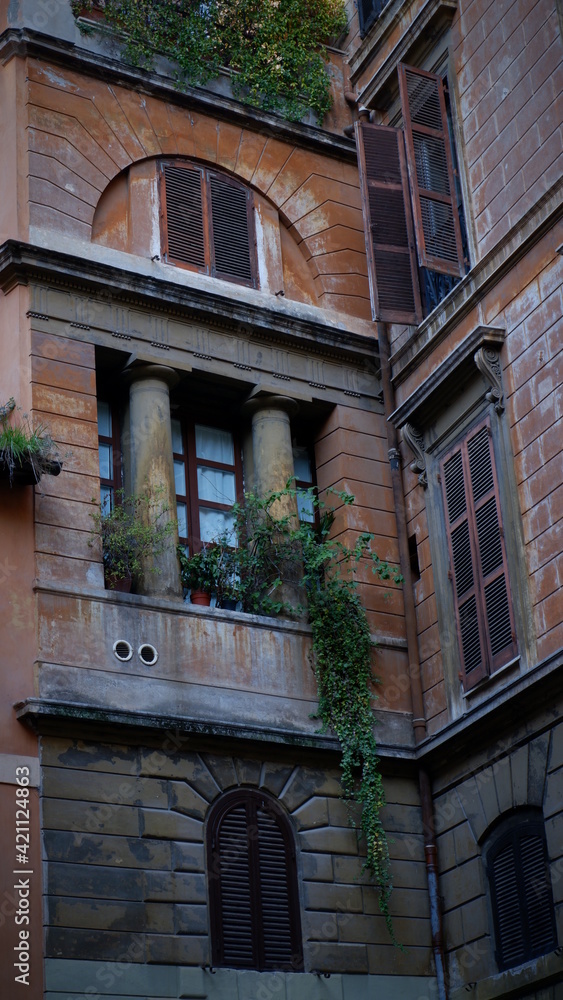 Naklejka premium Open window against and old wall