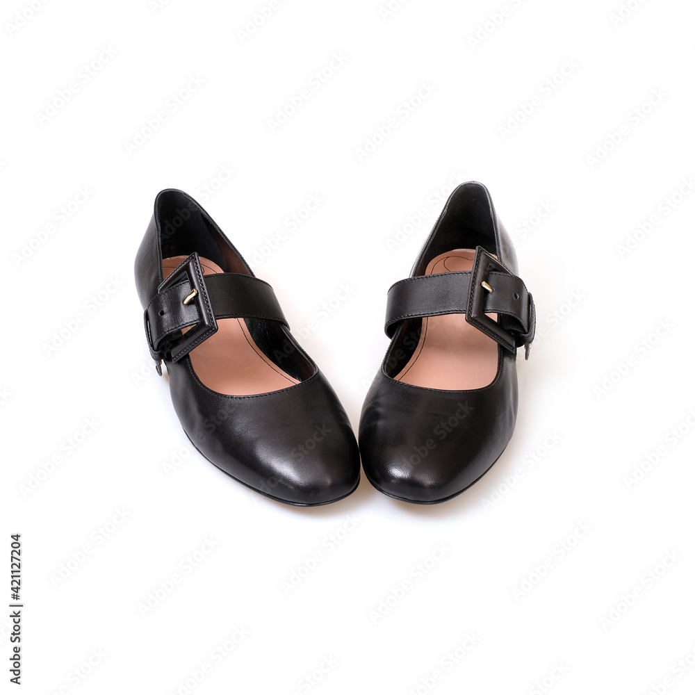 Black leather beautiful low-heeled black shoes isolated on white background Black leather beautiful low-heeled black shoes isolated on white background