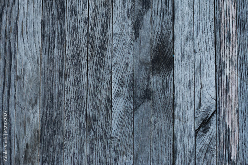 Surface of gray worn wooden planks in an upright position for vintage backgrounds