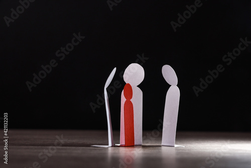 Quadro em tela Child bullying concept with paper cutouts and dark background