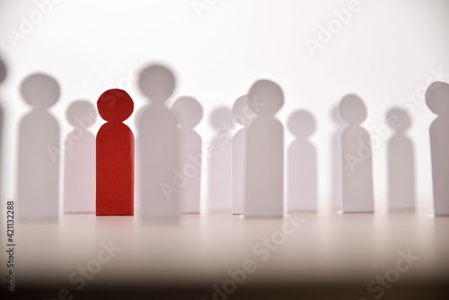 Social discrimination many paper men and a different one front