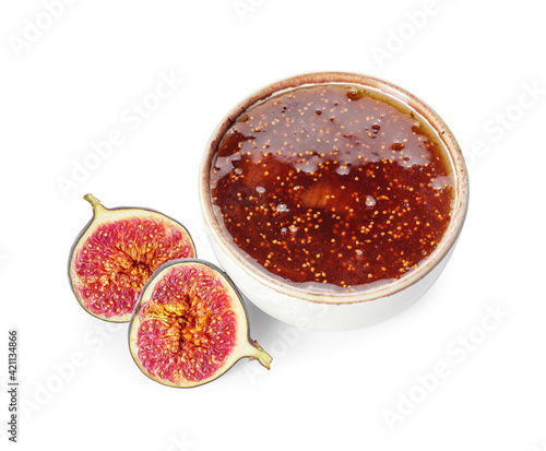 Bowl of sweet fig jam on white background