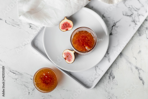 Fototapeta Naklejka Na Ścianę i Meble -  Sweet fig jam on white table