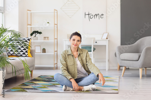 Beautiful young woman at home