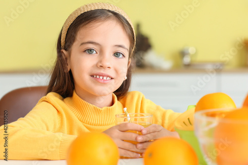 Cute little girl with orang...