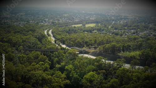 Drone image of the m4 motorway leading into the Blue Mountains from Western Sydney on a sunny day.
