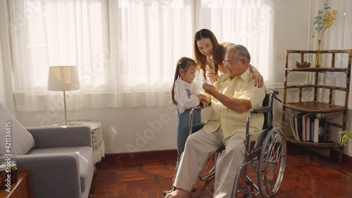 Grandfather and daughter share time together at home. Senior man Taking Pills Medicine. granddaughter take care older with love. Caretaker, Retirement, Caregivers at Home, Medicine and health care.