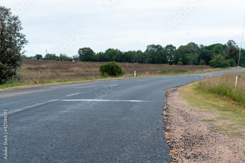 road in the countryside, empty road in the country leading into the horizon with rolling hills