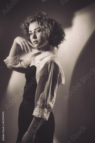 Vintage portrait of a young girl with curly hair