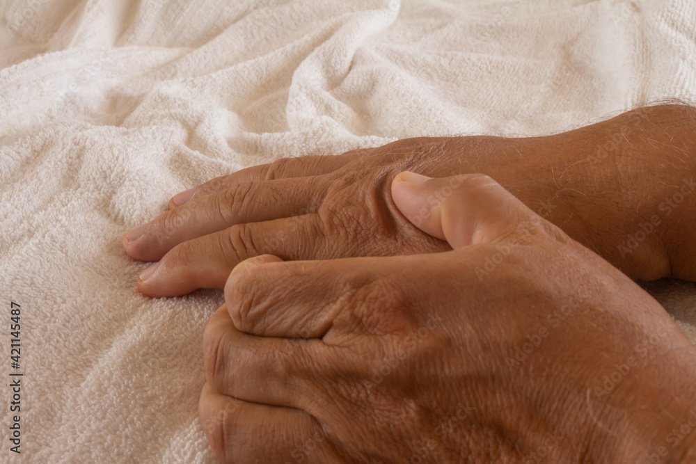 Fototapeta premium Adult man with pain in the hands. Joint pain in young adults.