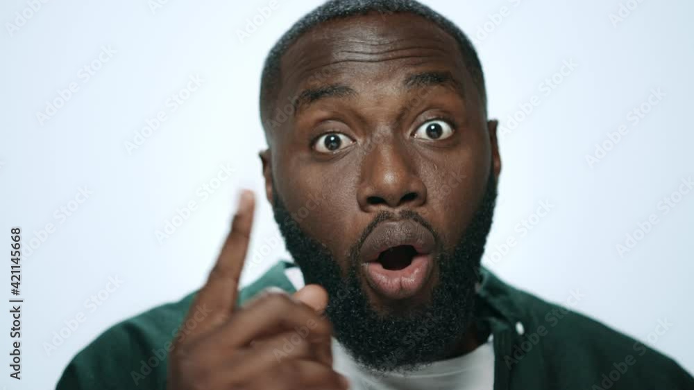 Portrait of african american man thinking idea on light background in studio. Portrait of african american man thinking idea on light background in studio.