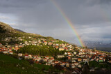 Rainbow above city of Livno, Bosnia and Herzegovina. Livanjsko polje surrounded by mountains in spring. 