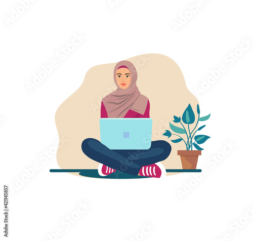 hijab woman sitting on the floor on the carpet with a laptop. Muslim woman wearing hijab sitting on carpet works with laptop modern flat cartoon design vector.
