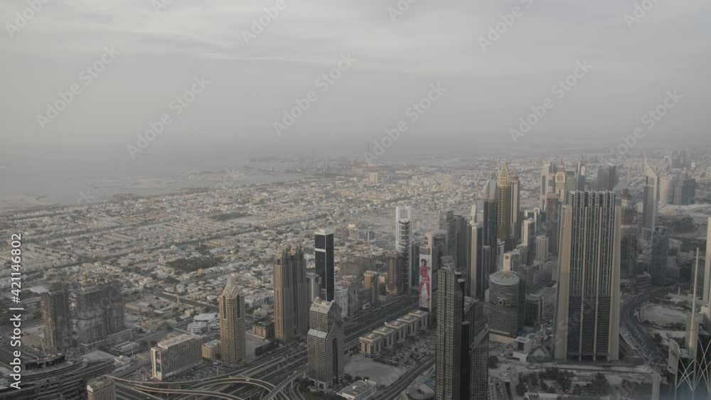 An aerial view of downtown Dubai with its large buildings and many skyscrapers. Filmed in 60fps slow motion from the top of the Burj Khalifa. An aerial view of downtown Dubai with its large buildings and many skyscrapers. Filmed in 60fps slow motion from the top of the Burj Khalifa.