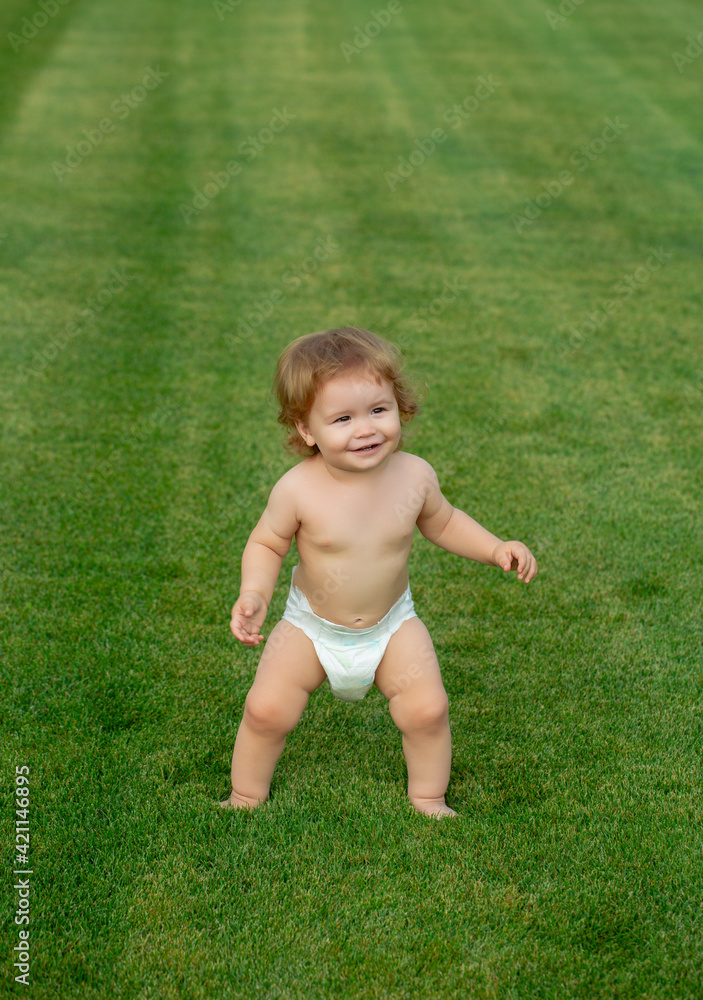 Baby feet on the green grass. Happy childhood and child healthcare. Baby feet on the green grass. Happy childhood and child healthcare.