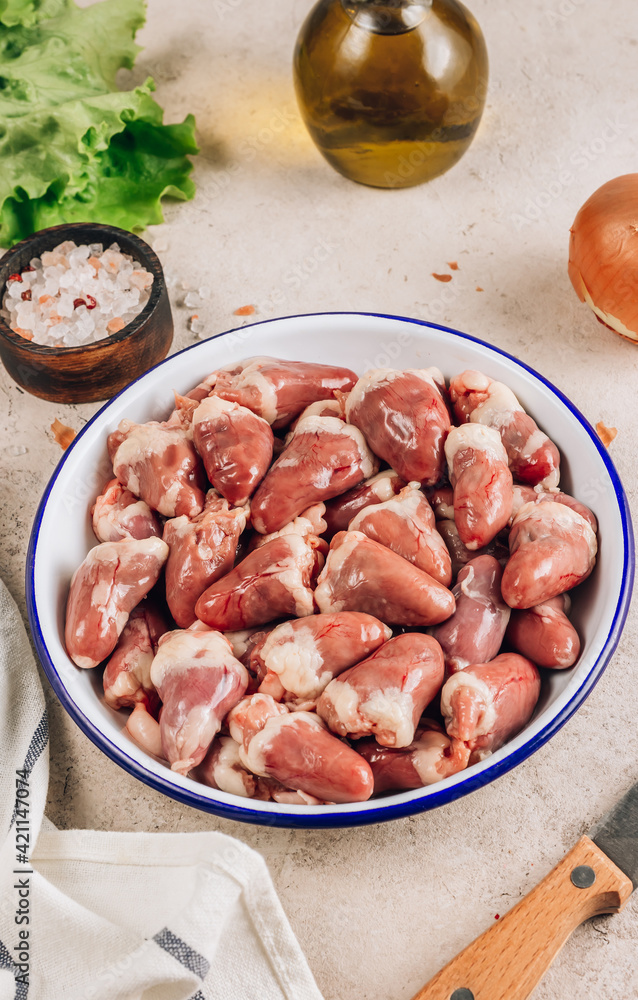 Fresh raw chicken hearts on concrete background. Fresh raw chicken hearts on concrete background.
