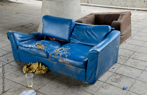 Closeup of Dirty Old sofas left on the side of the road, Selective Focus.